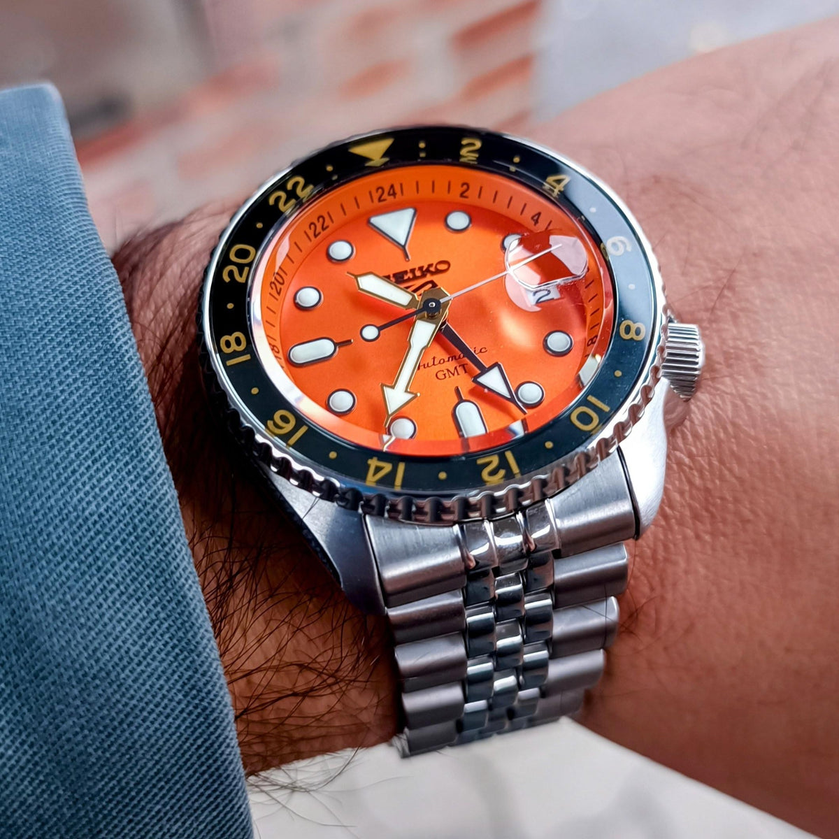 Seiko 5 Sports GMT Automatic Orange Dial Silver Steel Strap Watch For Men - SSK005K1
